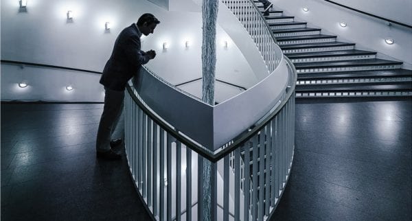 an architecture professional looking down at a flight of stairs