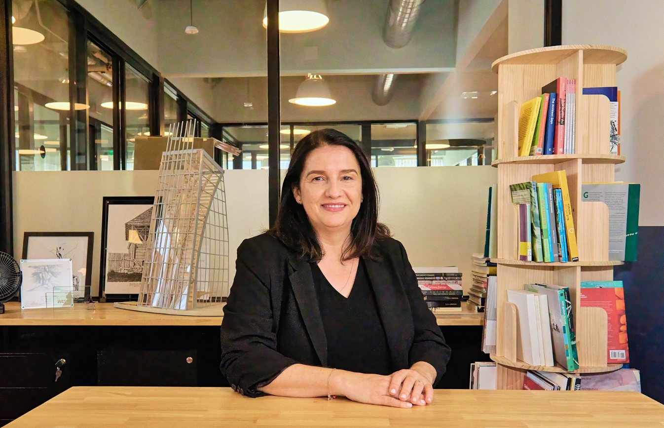NewSchool of Architecture & Design's Dean of Architecture, Daniela Deutsch sits in her office and looks at the camera