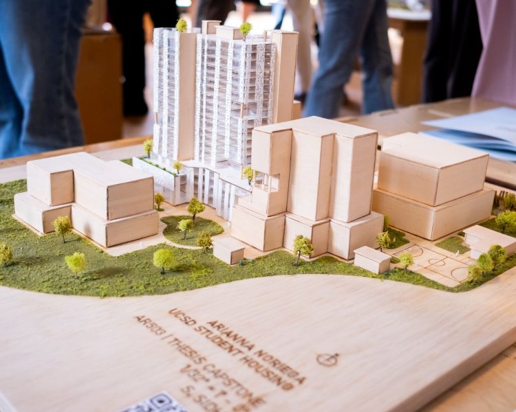 Wooden model of a tall UCSD student housing project designed by a NewSchool of Architecture & Design student