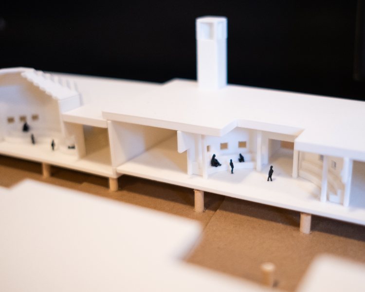 Model of a desert school (white one story building and the angle shows the interior of the building) designed by a graduate architecture student at NewSchool of Architecture & Design