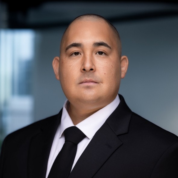 Shane Yee looking professional with a dark suit and tie