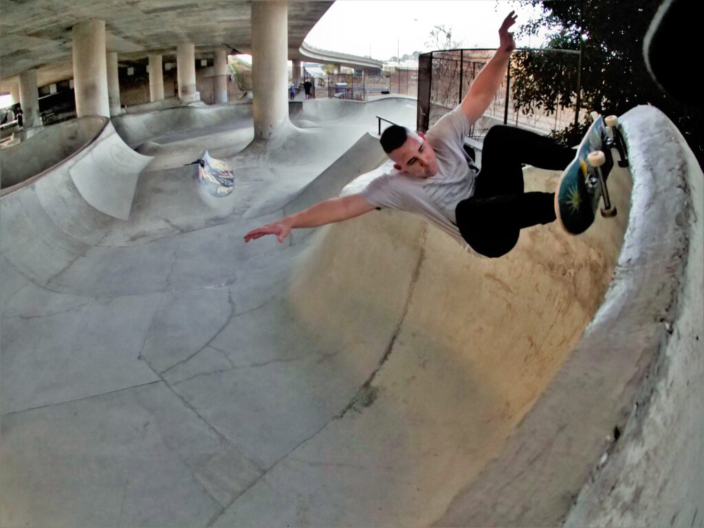 Shane skateboarding on a half-pipe on Washington Street