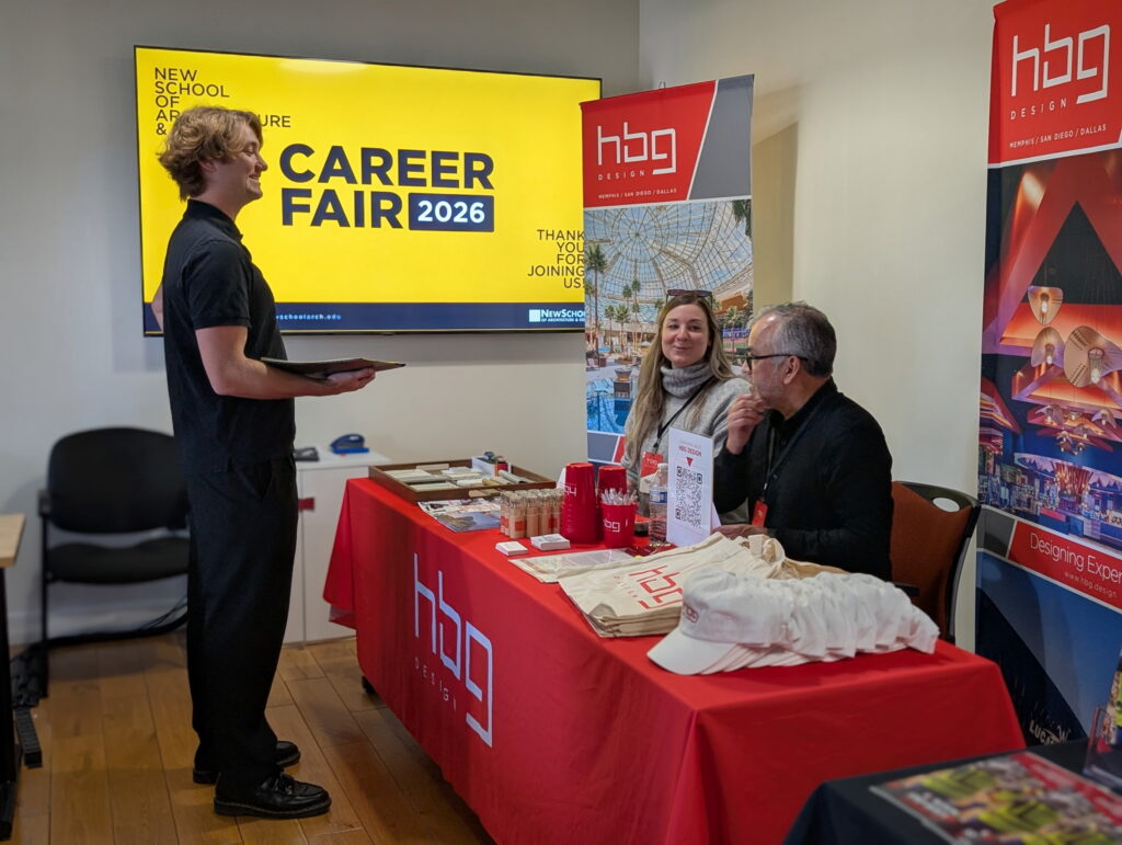 student talking to representatives from hbg